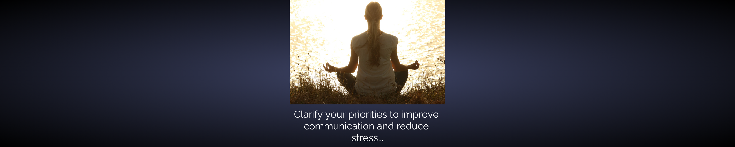 Person meditating by a body of water during sunset