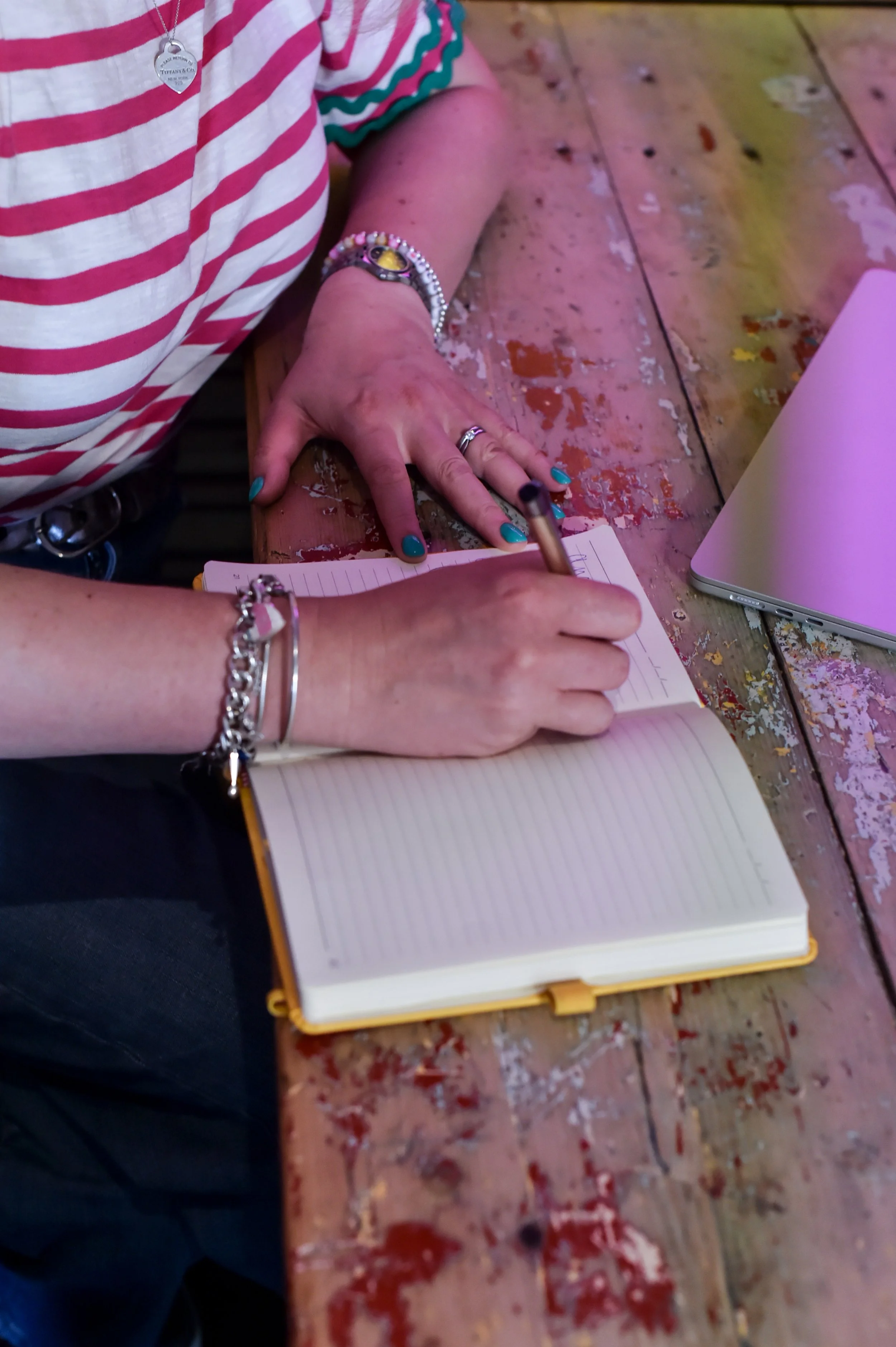 Wedding celebrant creating notes for a wedding ceremony. Ideas and script writing. Modern, fun and personal. Not stuffy.