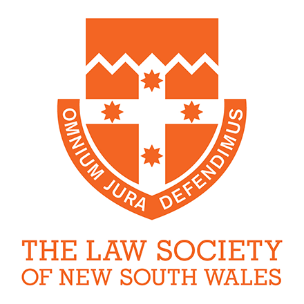 The logo of The Law Society of New South Wales, featuring an orange shield with a white cross and star symbols, surrounded by a circular banner with the organization's name and motto, 'Ominium Jura Defendum.'