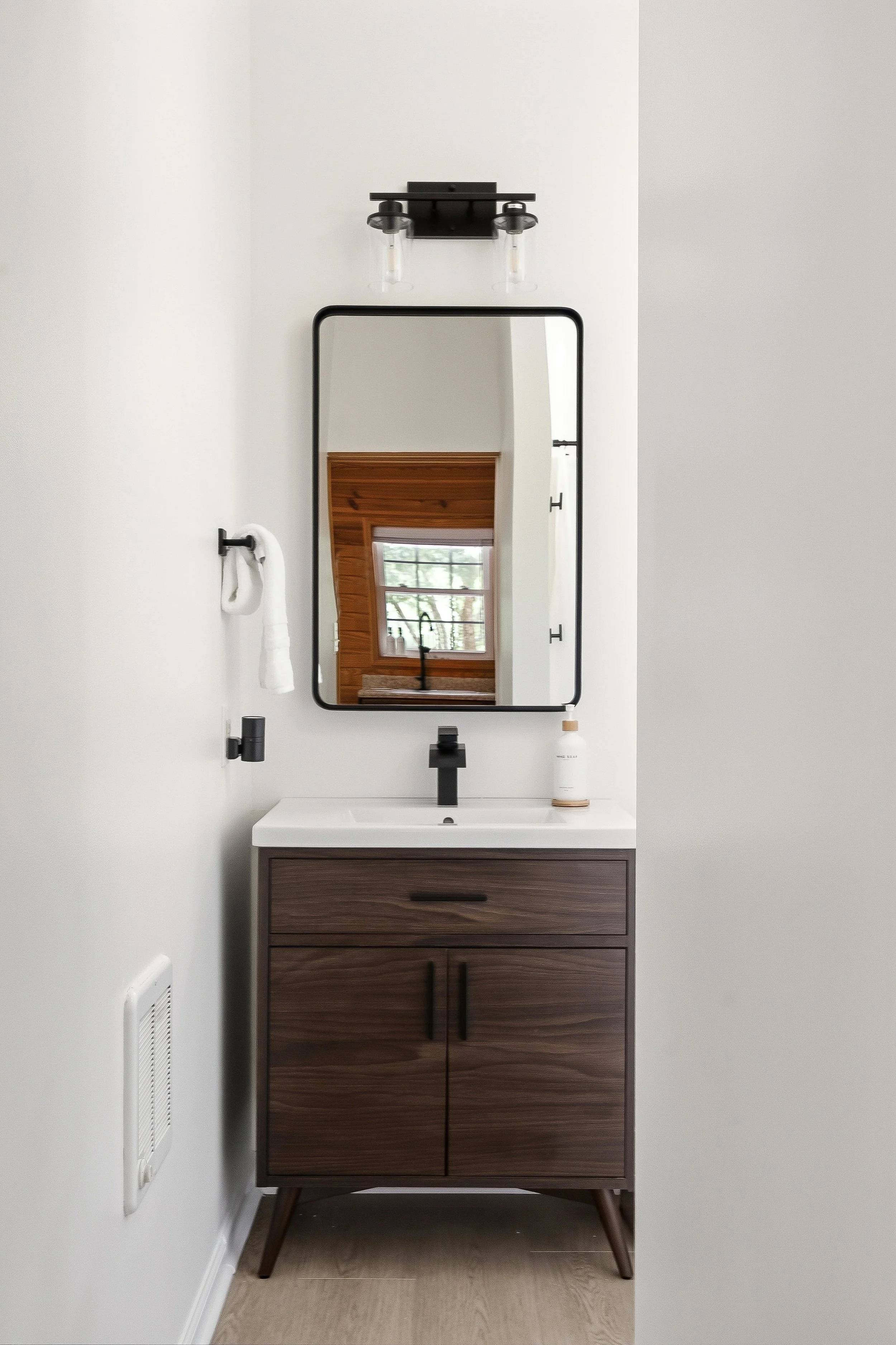 Updated bathroom has a shower and basic toiletries at your fingertips.