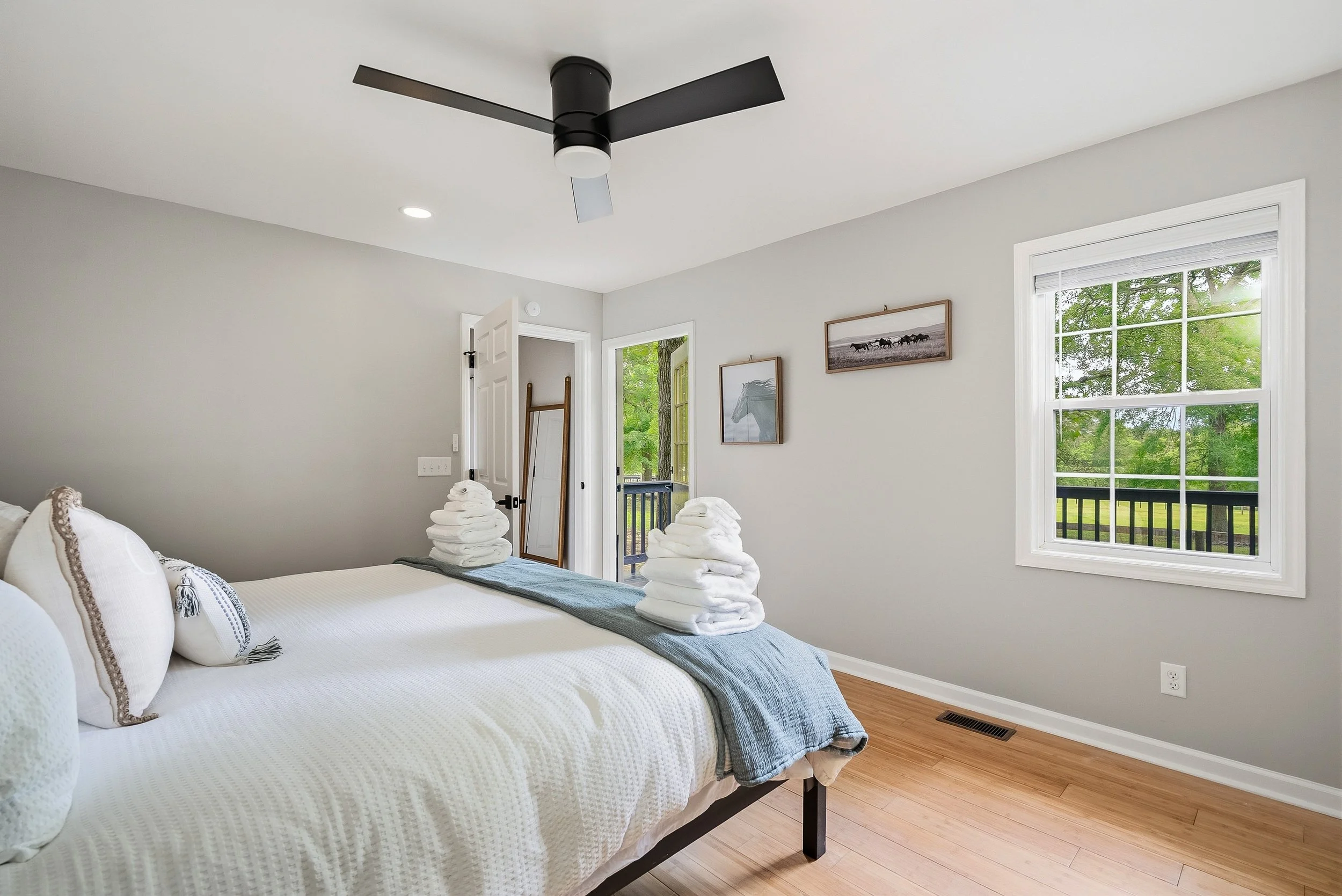 Bedroom has direct access to the deck and beautiful, private pasture views.