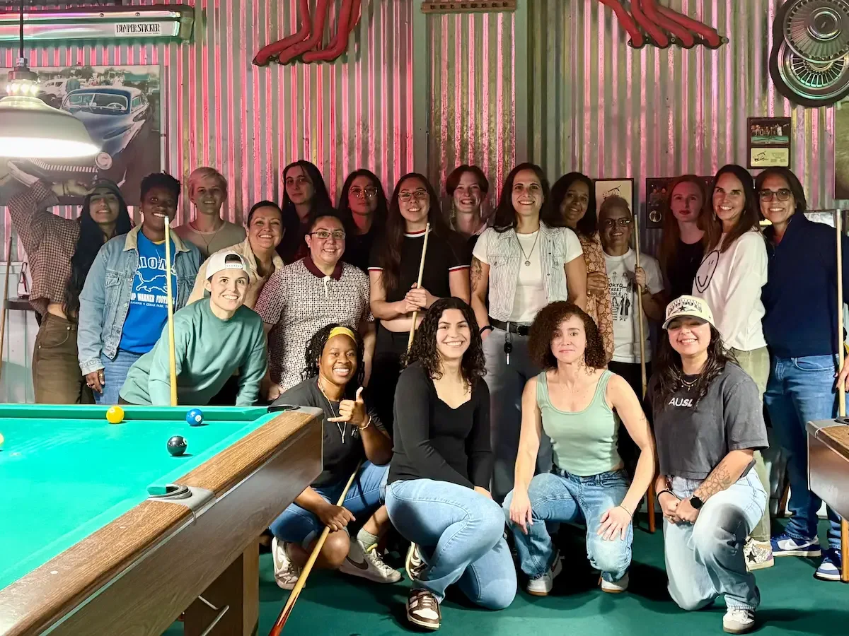 Gay women posing for a group photo taken at Slick Willie's in Austin for a Sapphic meetup.