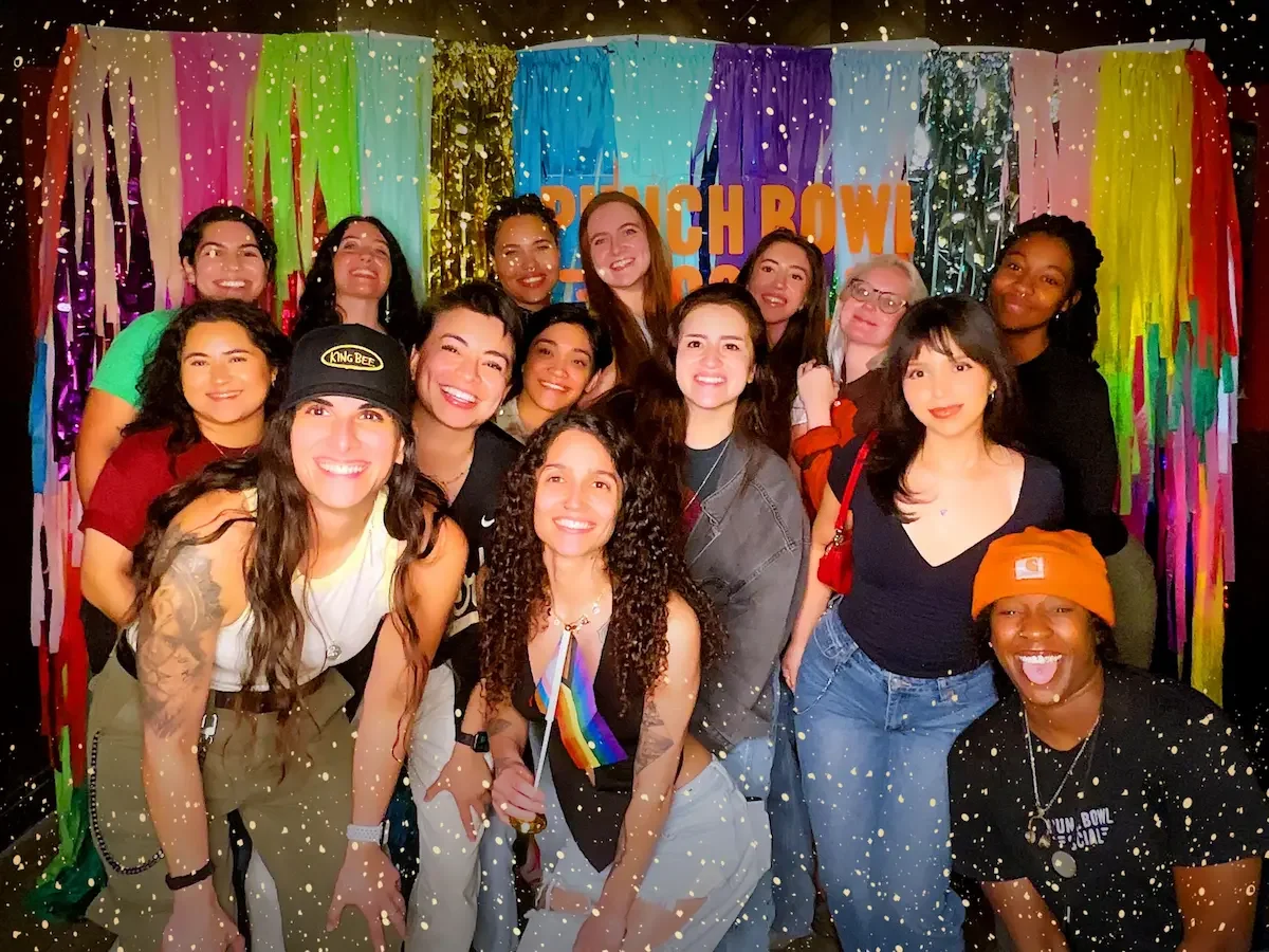 Queer women in Austin pose for a picture at Punch Bowl Social