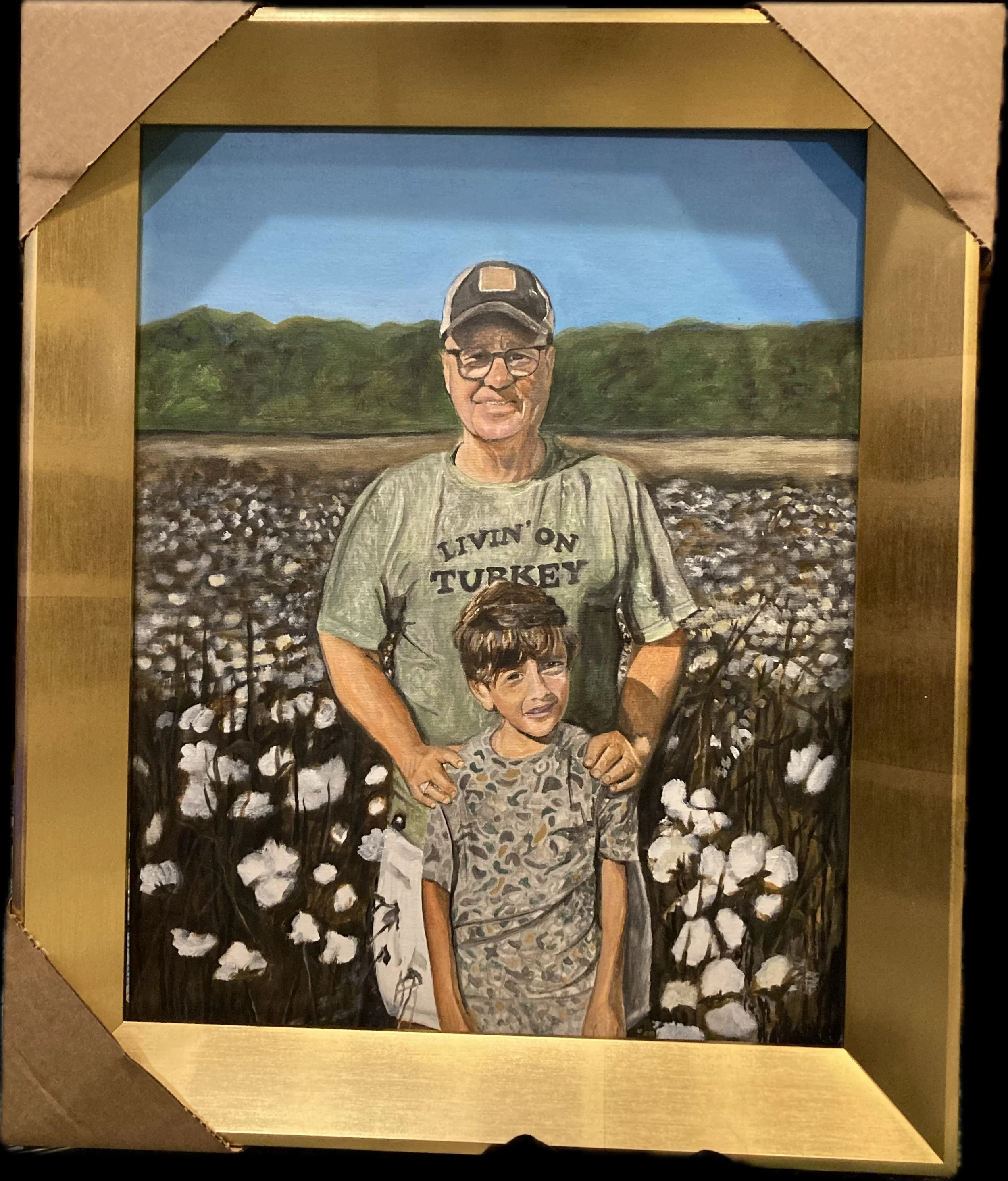 A painted portrait of a man and a young boy standing in a cotton field. The man is wearing a cap, glasses, and a t-shirt that reads 'LIVIN' ON TURKEY.' The boy wears a camouflage shirt and looks slightly distressed. Behind them are green trees and a 