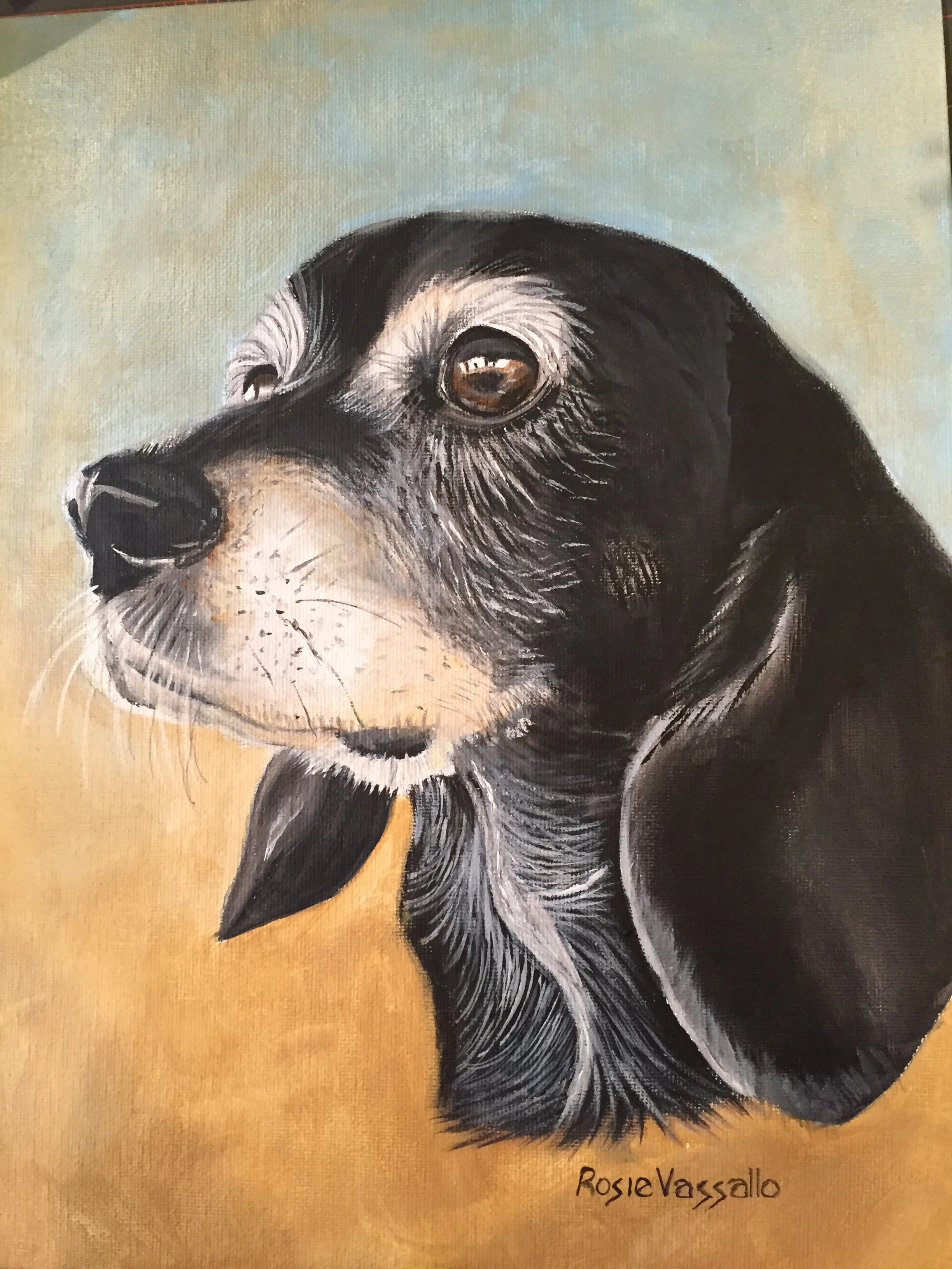 Painting of a black and tan dog with a beige background, signed RosieVassallo.