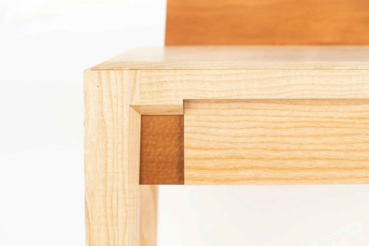 Journal Desk detail — hand-carved stippled Swiss pear drawer front set within a rippled ash frame, by Henry Crabb