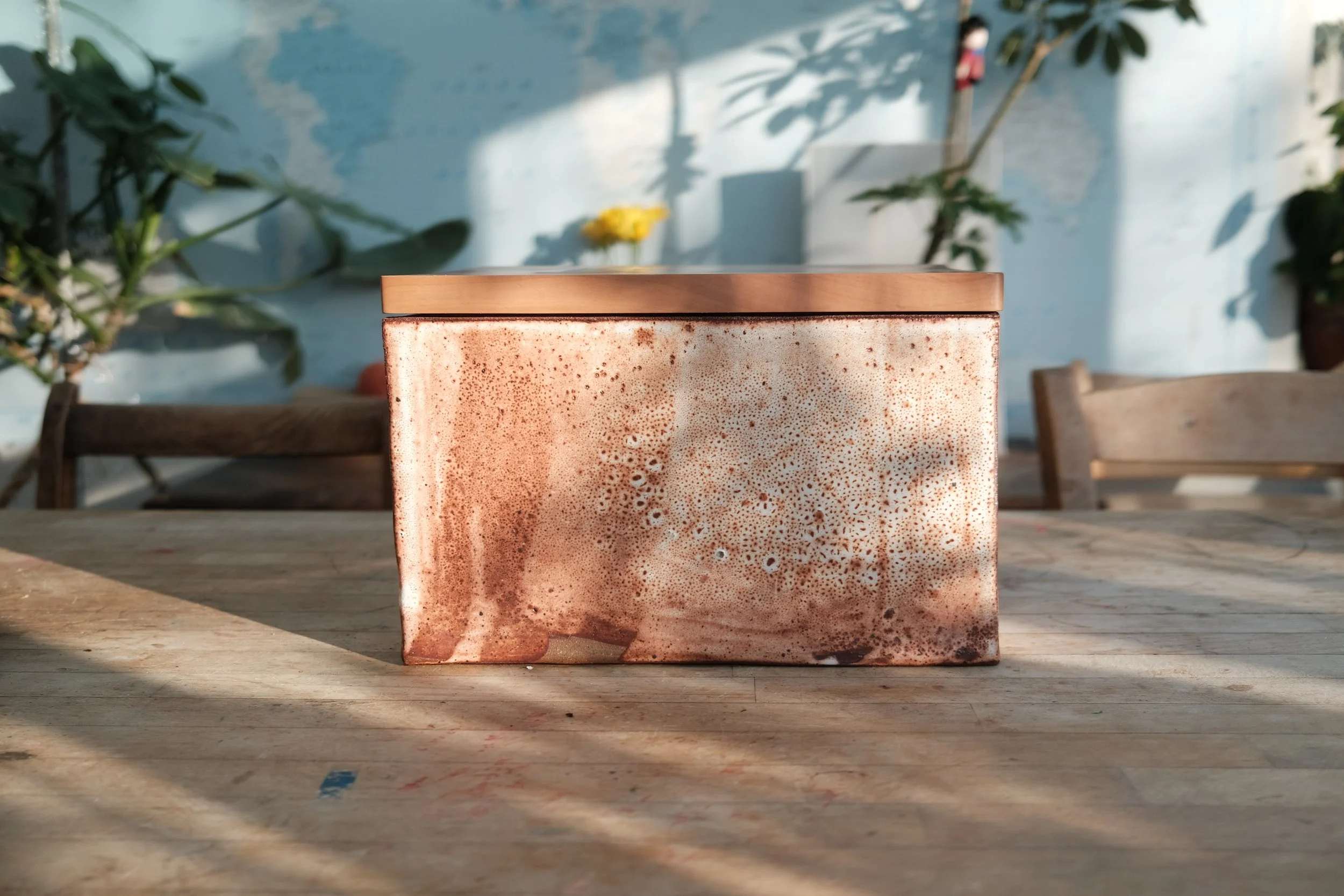 Handmade bread bin in shino-glazed Cornish clay with Swiss pear wood cutting board lid, made in collaboration with Imogen Kempton, apprentice at Leach Pottery, St Ives
