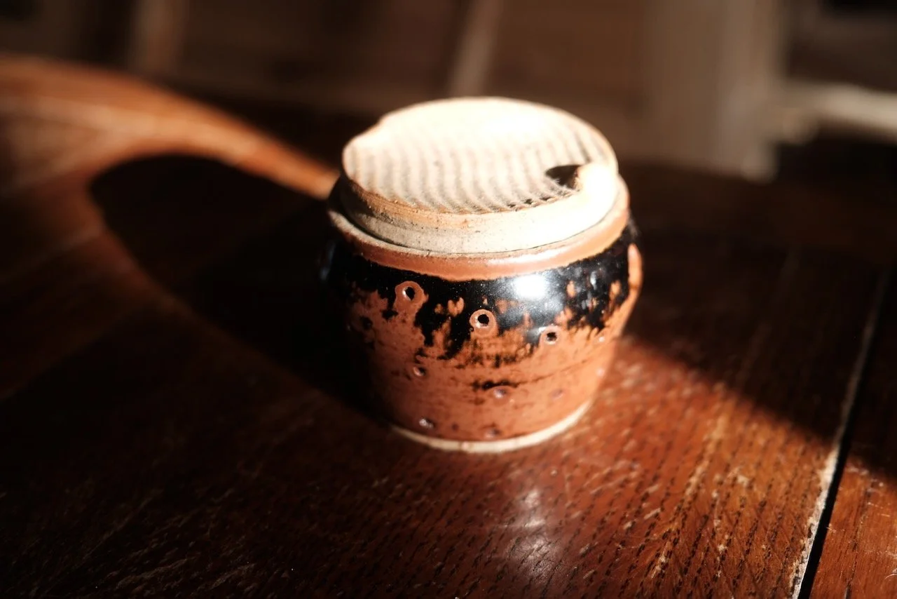 Hand-thrown ceramic pot with tenmoku glaze and raw clay lid — small object by Henry Crabb, West Cornwall