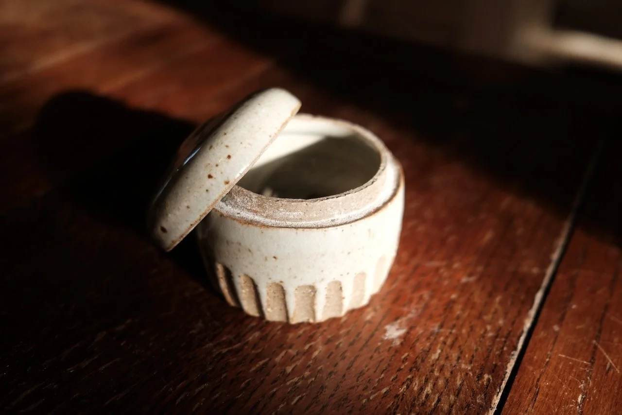 Hand-thrown white glazed ceramic pot with fluted sides and domed lid — small handmade object by Henry Crabb, West Cornwall