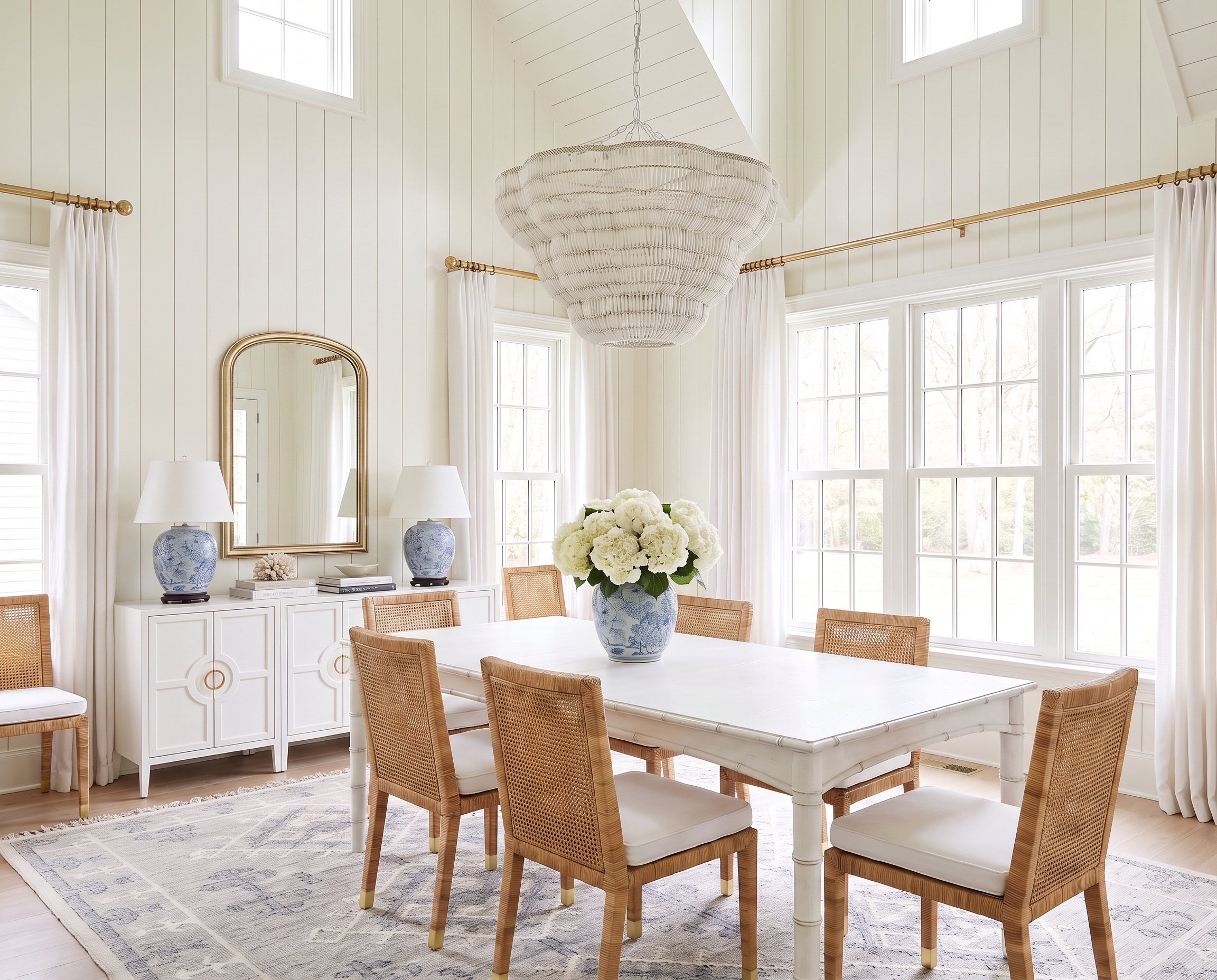 A Classic Blue &amp; White Dining Room with Vaulted Ceilings and Shiplap