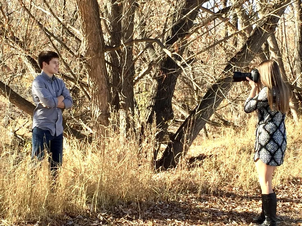 Longmont family portrait photographer Lisa Doane capturing outdoor family photos in the wooded trail areas at Golden Ponds Nature Area in Colorado.