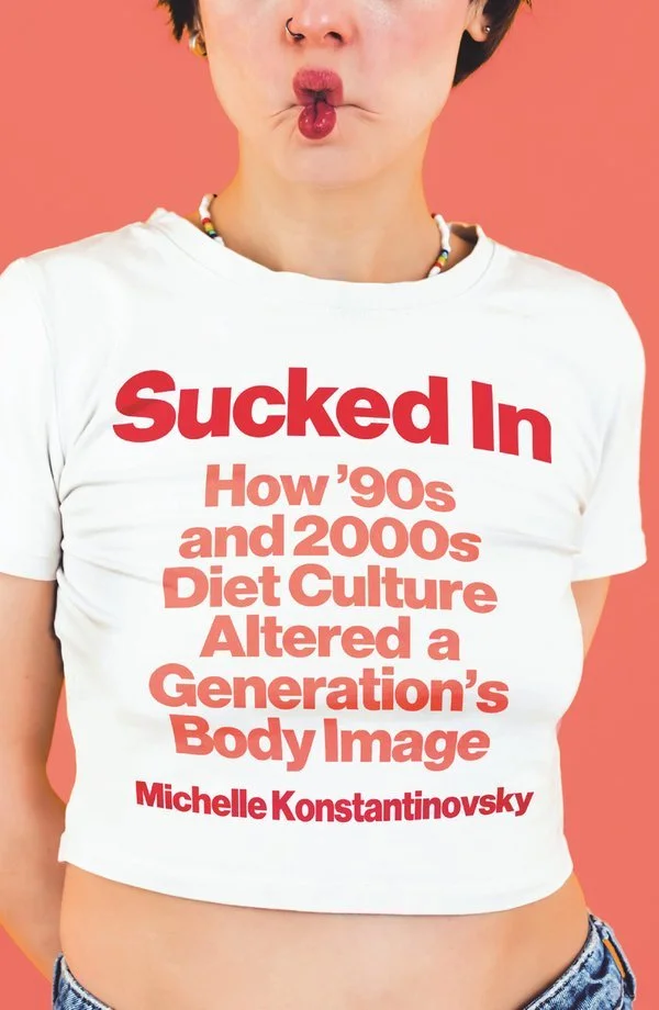 The cover of Sucked In depicts a woman with puckered lips sporting a white t-shirt with cherry-pink typography spelling out the title of the book.