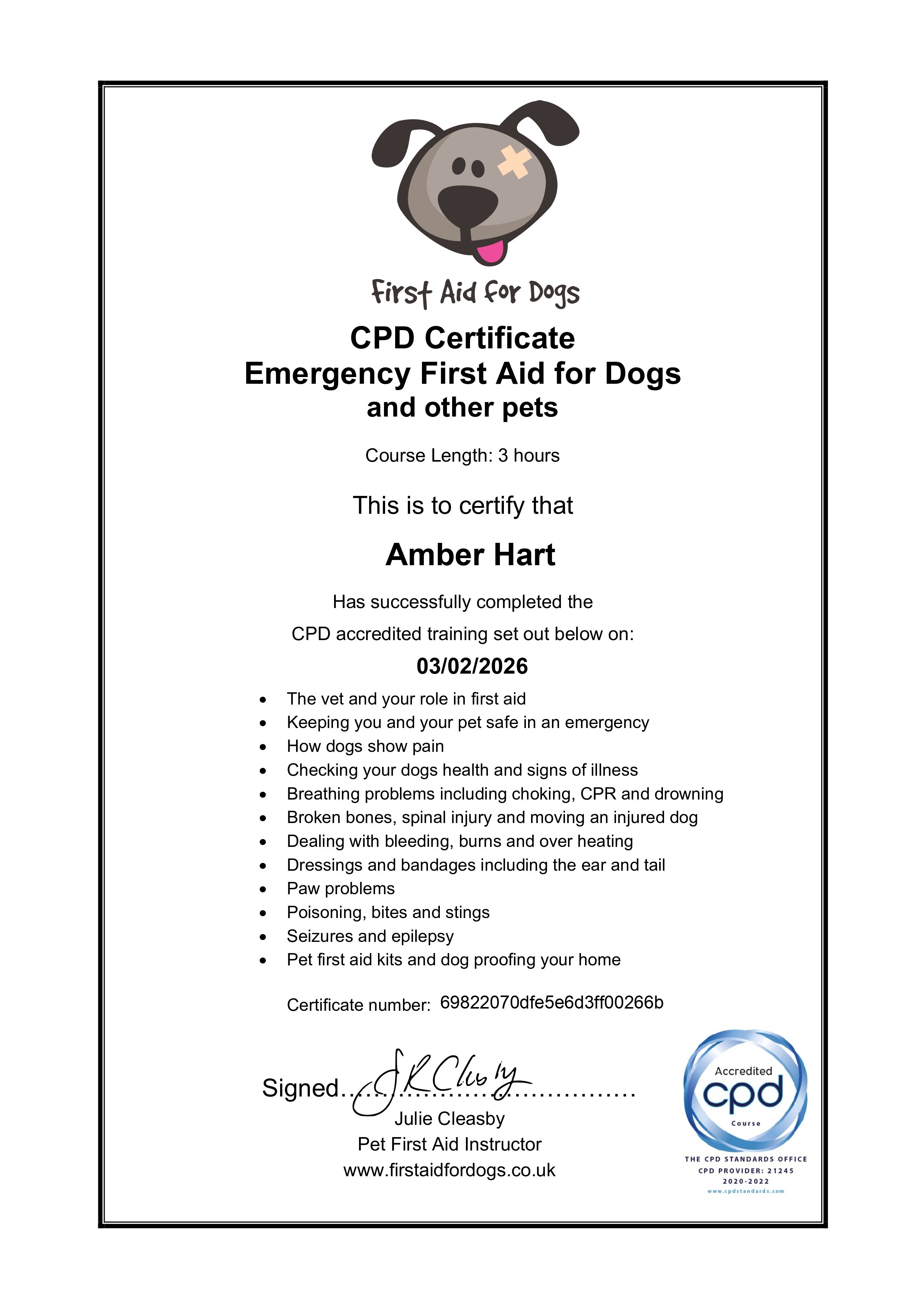 CPD certificate for Emergency First Aid for Dogs issued to Amber Hart, signed by Julie Cleasby, with a cartoon dog with an eye bandage and tongue out at the top, and an accredited CPD logo at the bottom right.