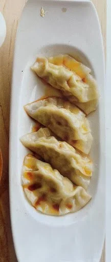 Vegetable pot stickers with black vinegar and sesame dipping sauce