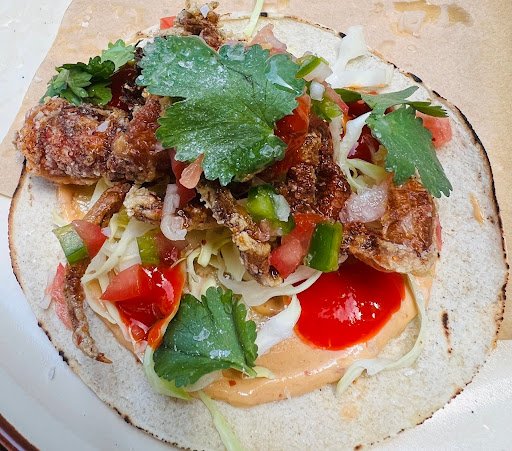 Slow braised pork Tacos served with pickled red cabbage and pico de gallo’