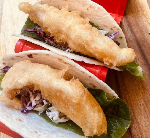 Fish tacos sriracha mayo Mexican slaw tortillas