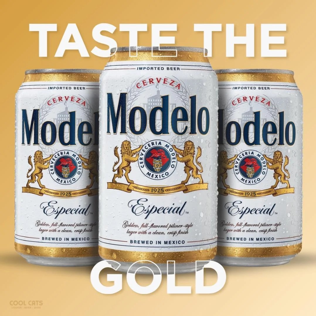 Three cans of Modelo Especial beer with water droplets on the surface, positioned against a beige background. Text above says 'Taste the' and text below reads 'Gold'.