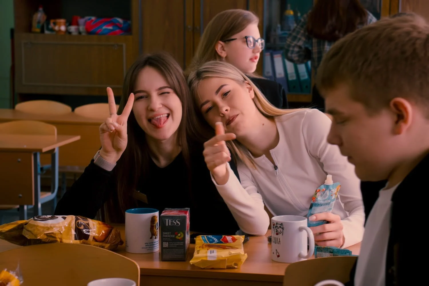 Middle school students having lunch together in school cafeteria