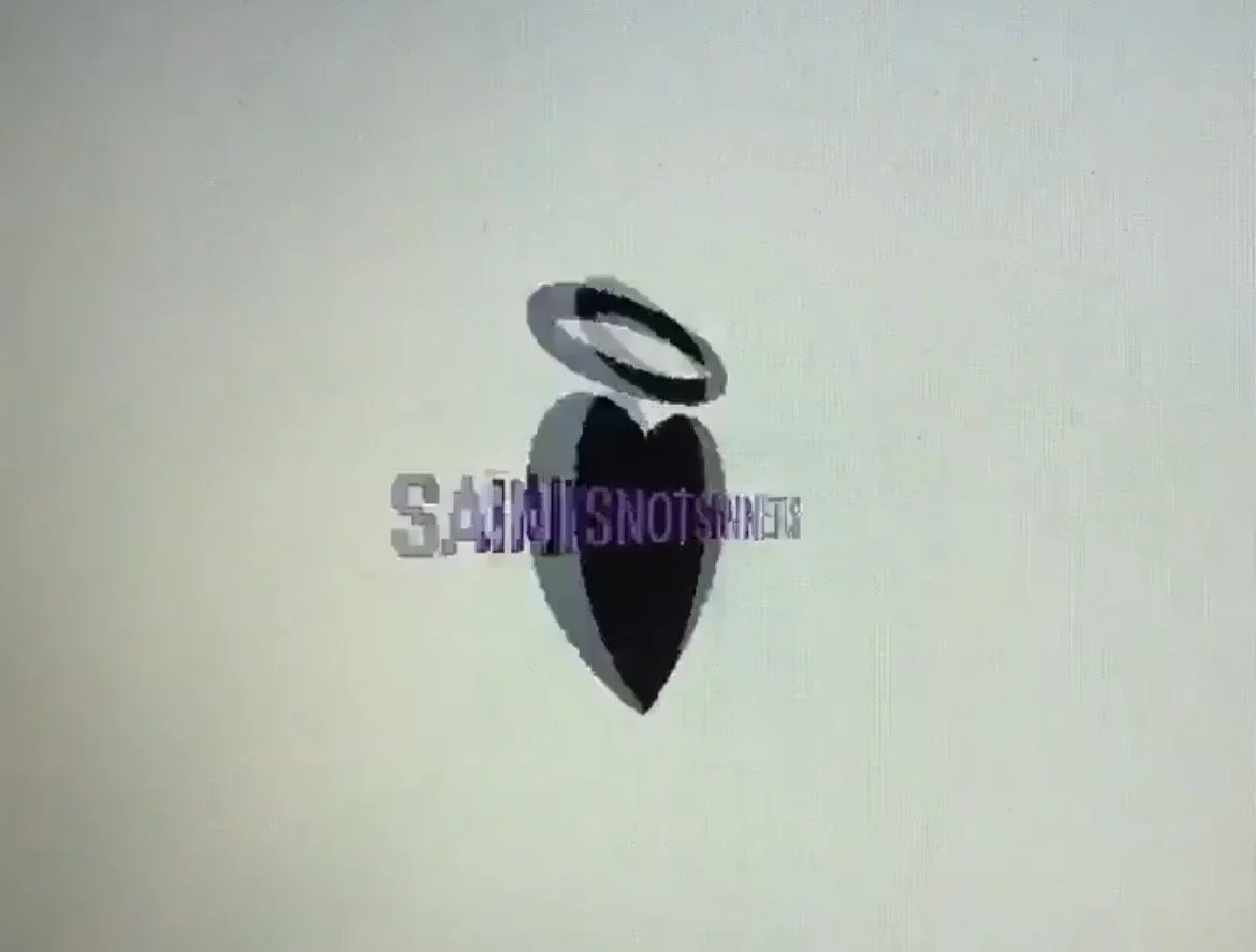 A logo with a black heart shape, black halo above, and the text 'SAINTSNOTSINNERS' in purple