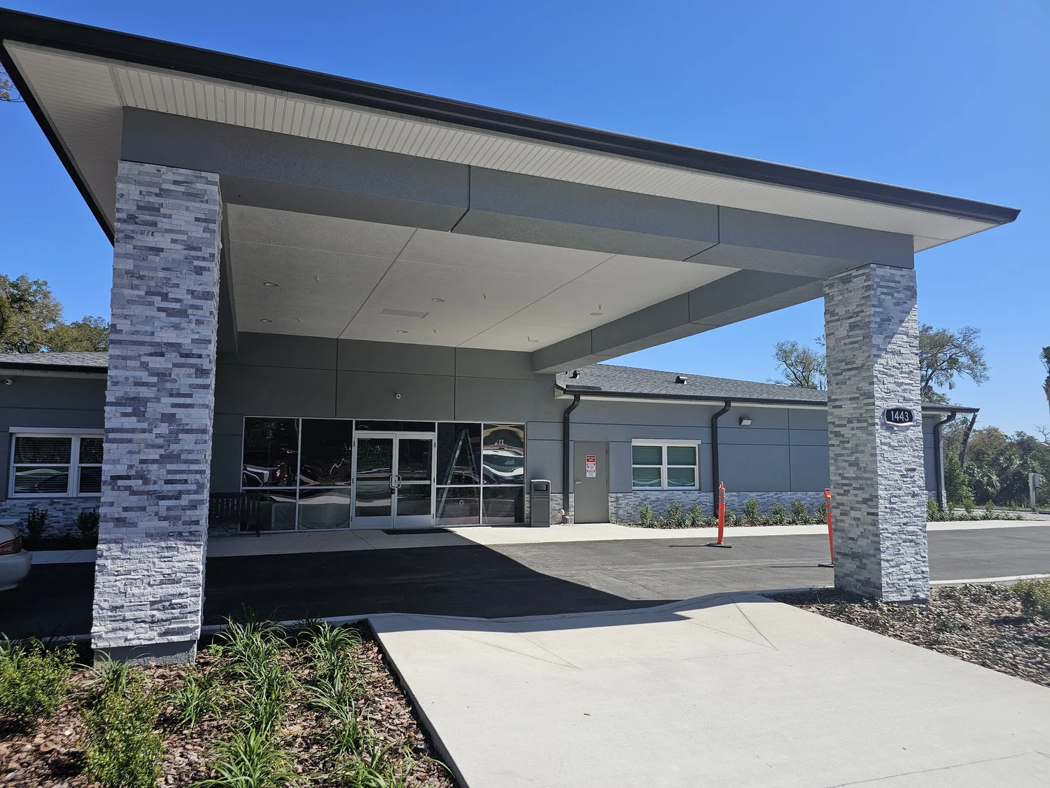 Apopka Life Care exterior entrance with finished columns and a covered driveway
