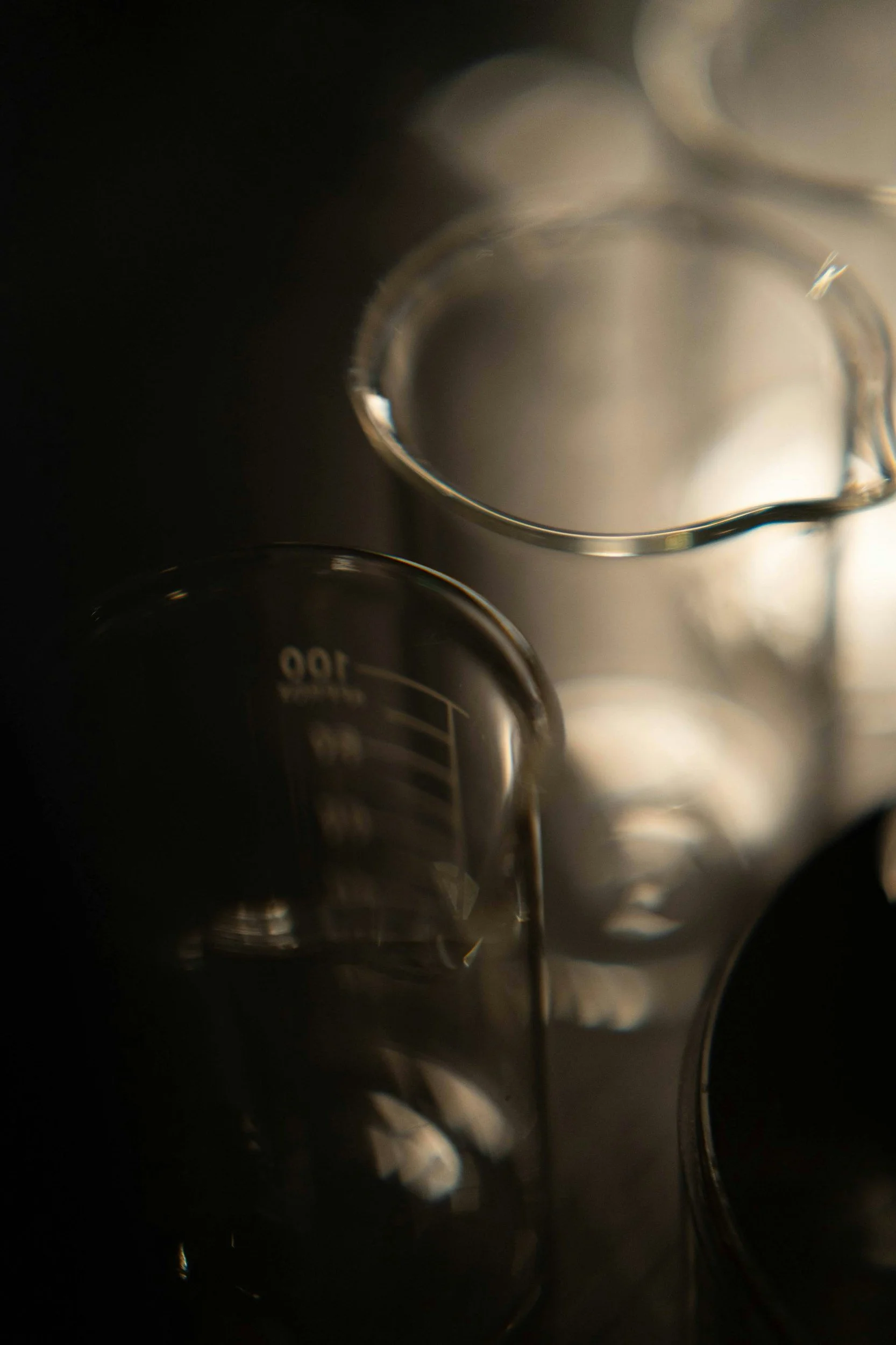 Close-up of a metallic liquid measuring cup.