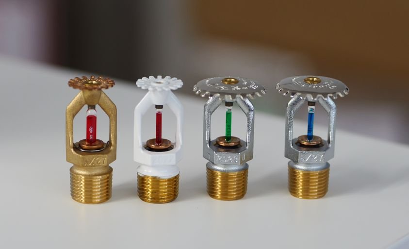 Different sprinkler head temperature ratings used in fire protection system design for varying ambient conditions
