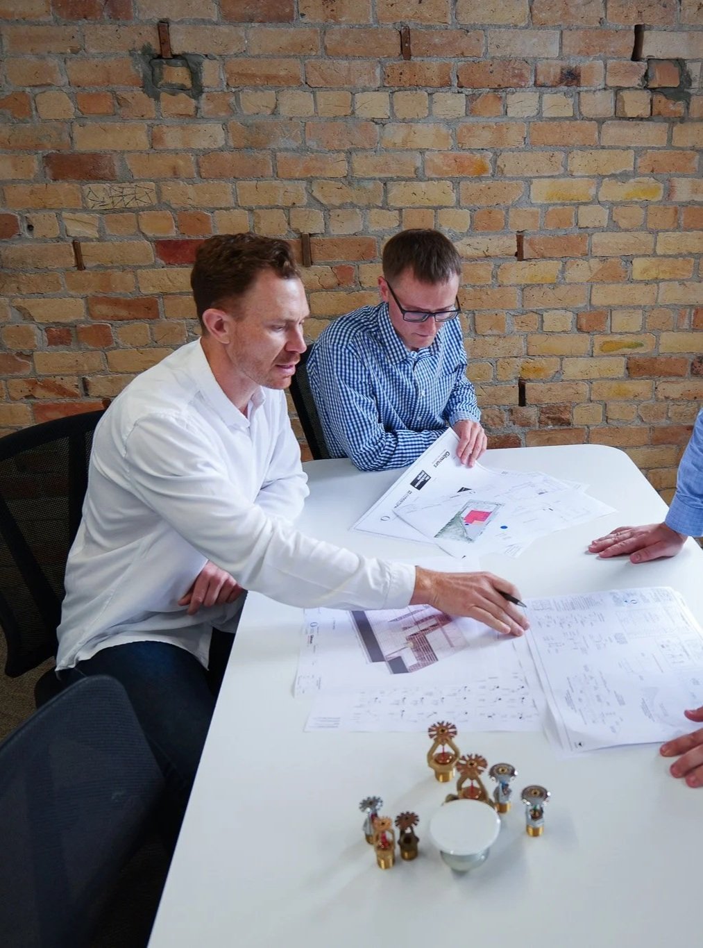 Fire protection consultants collaborating on coordinated building design at Fortis Fire