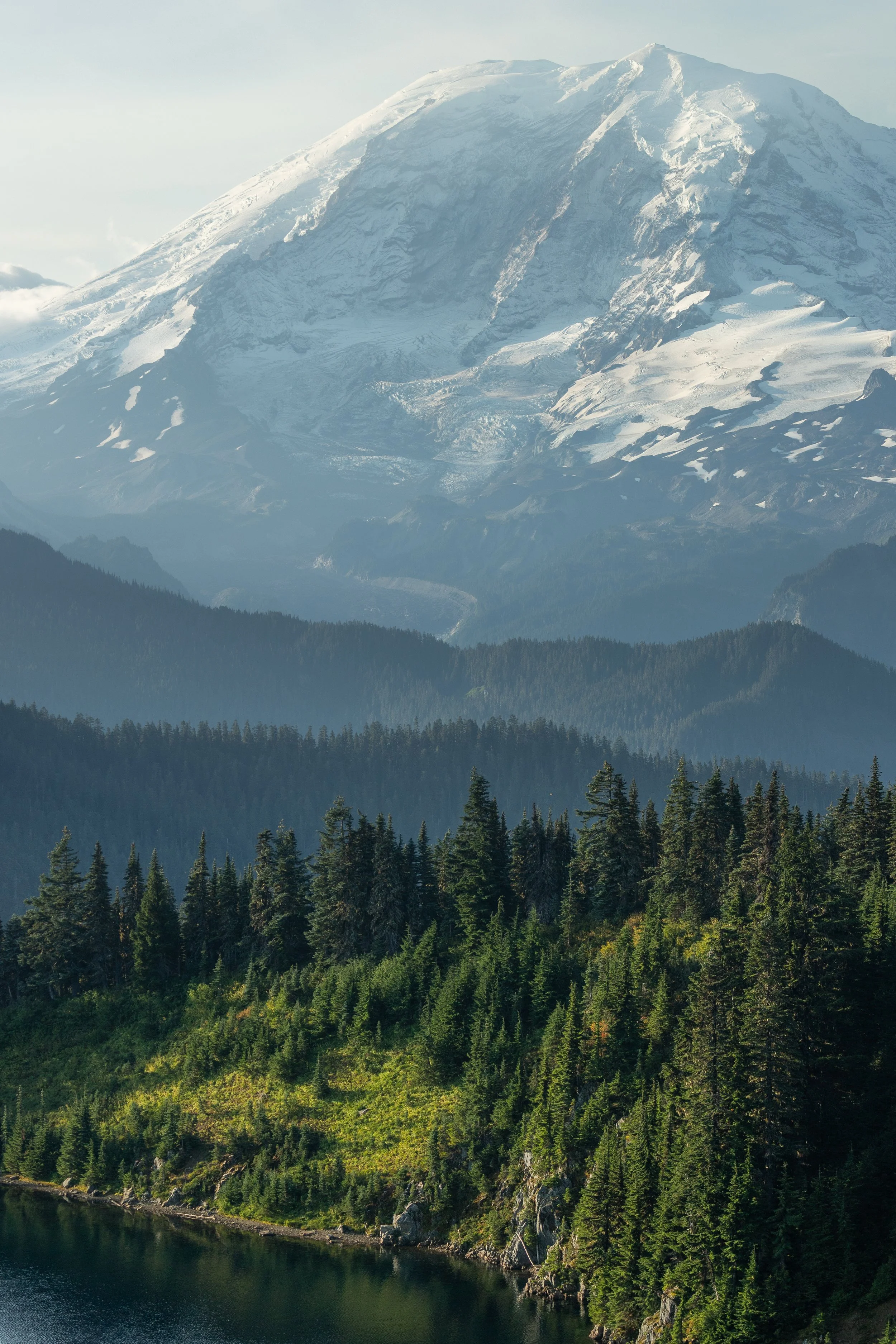 Morning light shines on Summit Lake and Mount Rainier in Washington. 