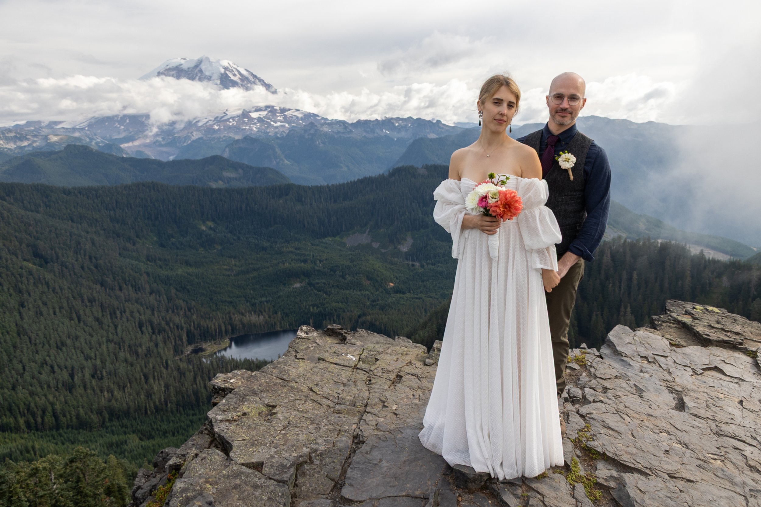 Jessie and Ryan Keaton pose for portraits on their wedding day near Summit Lake in Washington, with Mount Rainier rising in the distance.
