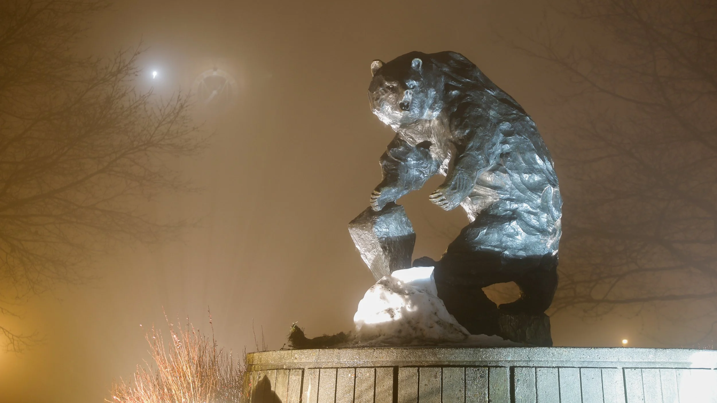 The University of Montana's signature Grizzly Bear statue on a foggy night in Missoula. 