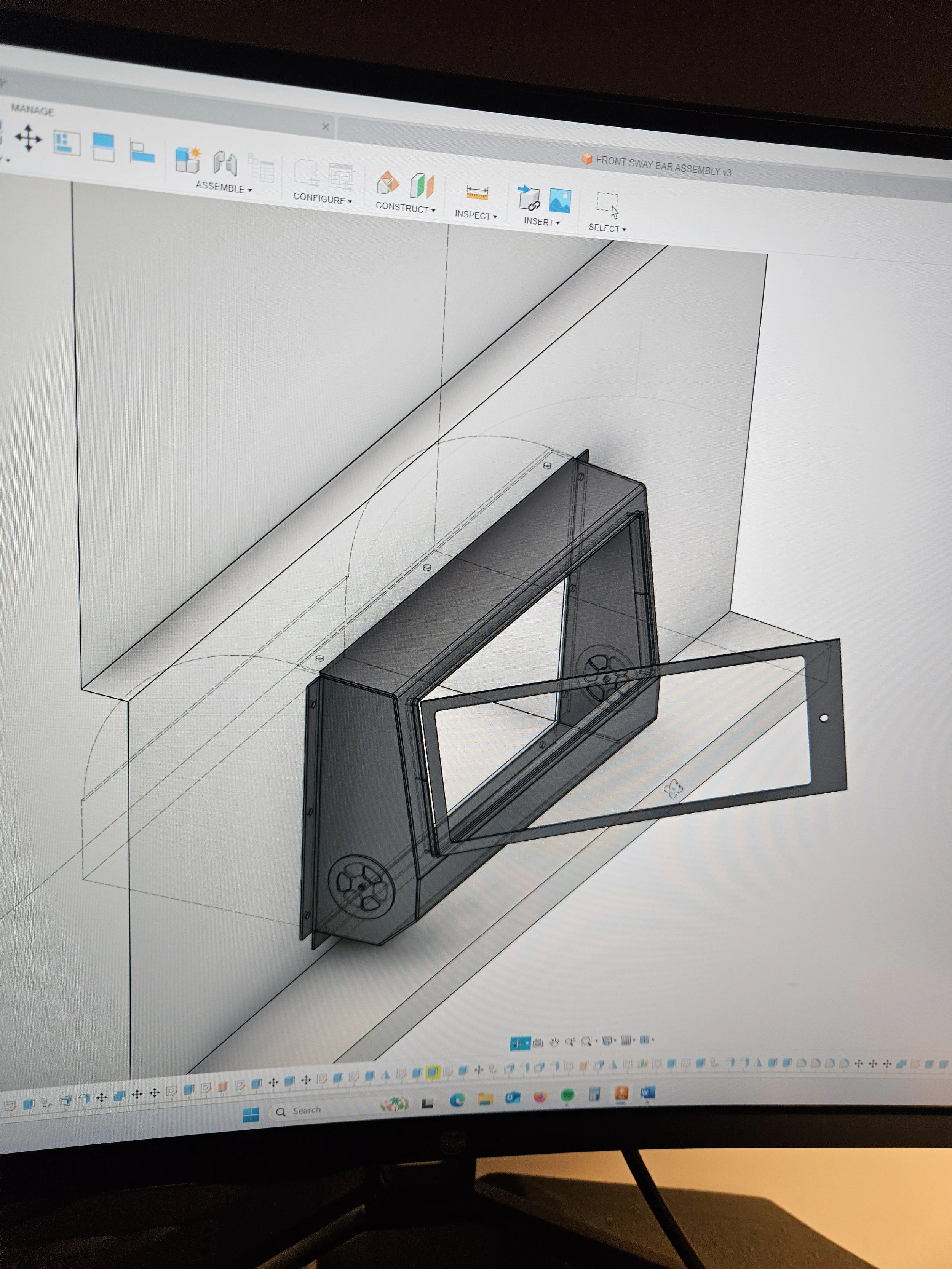3D CAD design of a rectangular electronic enclosure with a clear front panel, showing internal components and mounting holes, on a computer screen.