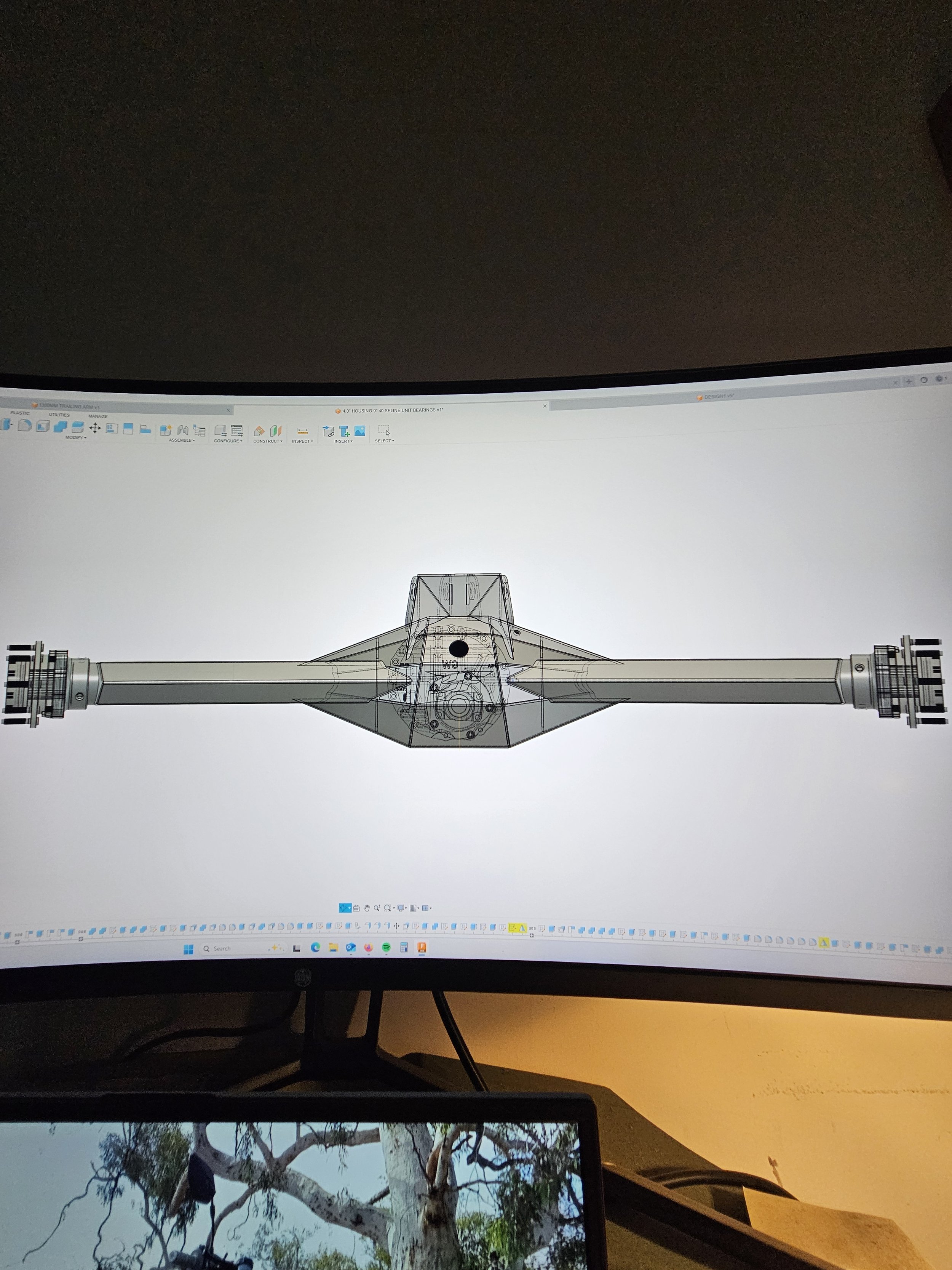 Computer screen displaying a 3D CAD model of a spacecraft or aircraft component.