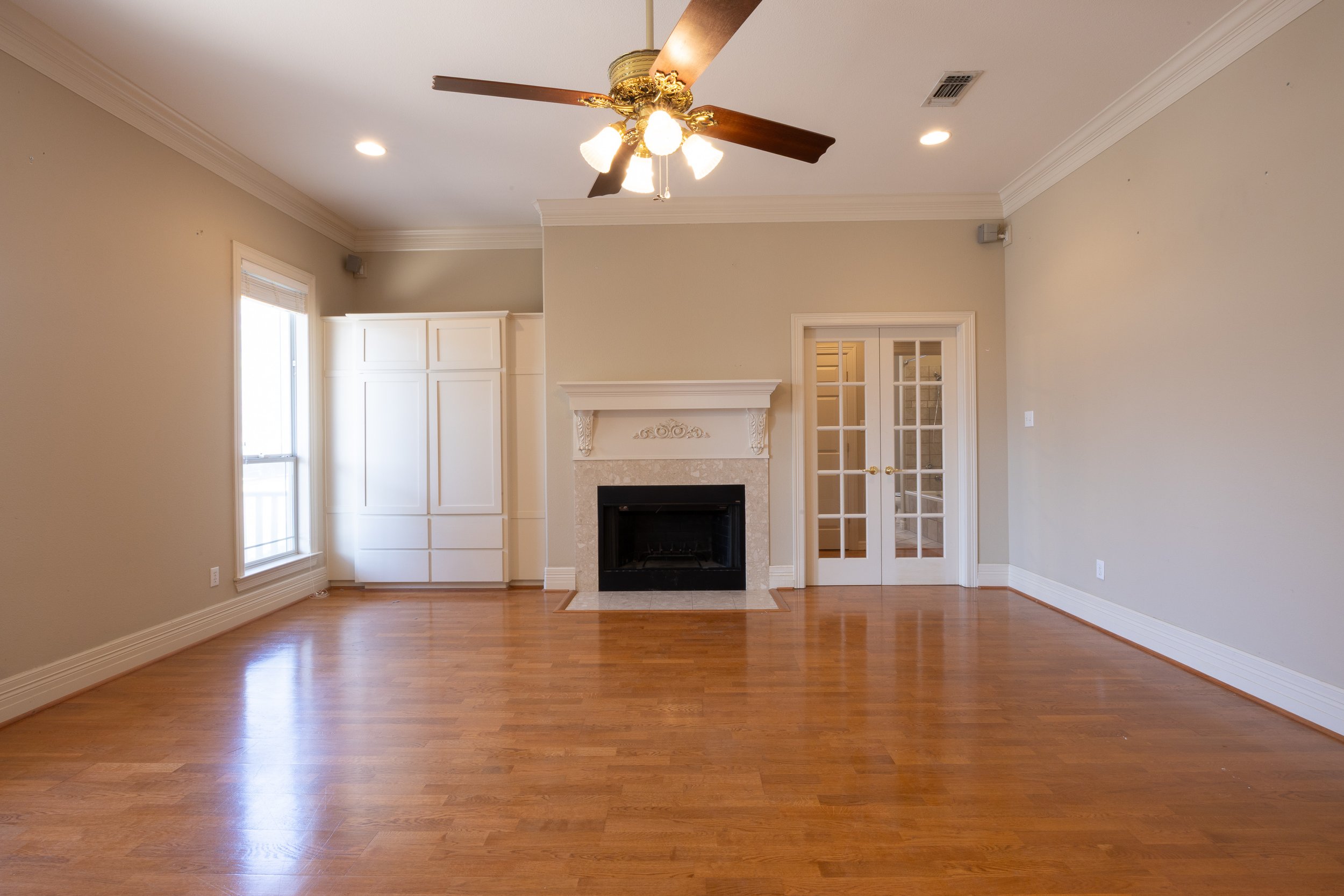 The interior features a large living room and a flexible Mother-in-Law floor plan, with rich hardwood floors and abundant natural light.