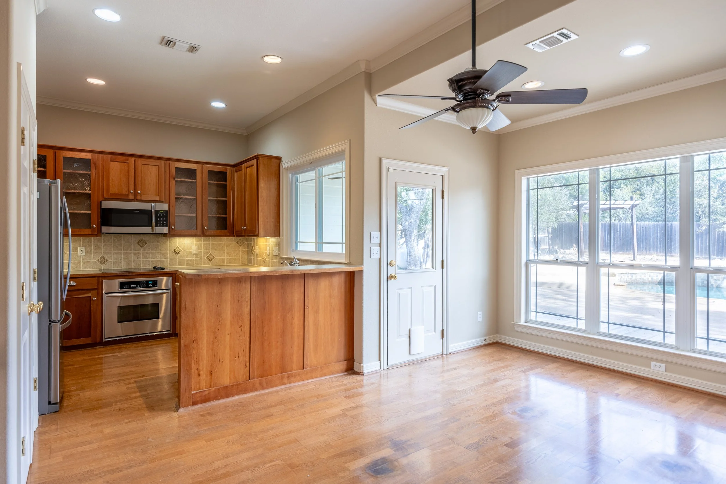 At the heart of the home, the modern kitchen features stainless steel appliances and an integrated water softener system.