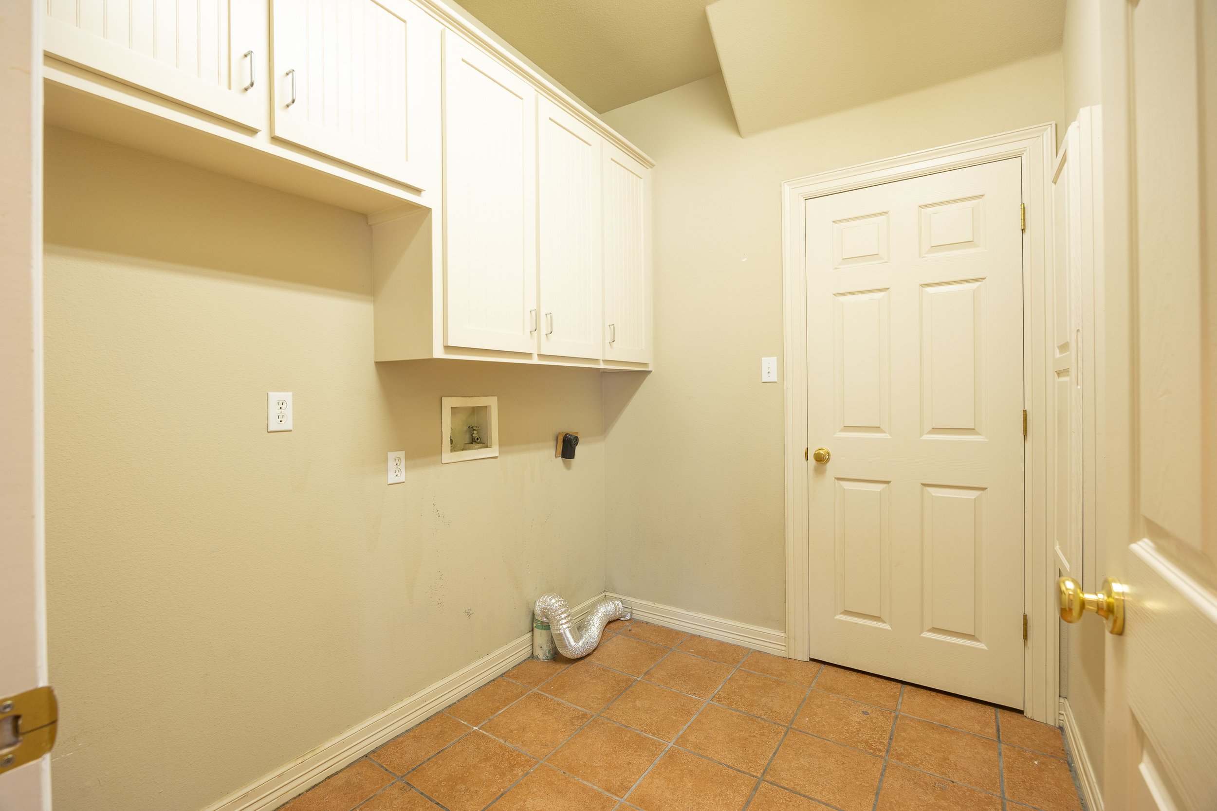The interior features a large living room and a flexible Mother-in-Law floor plan, with rich hardwood floors and abundant natural light.