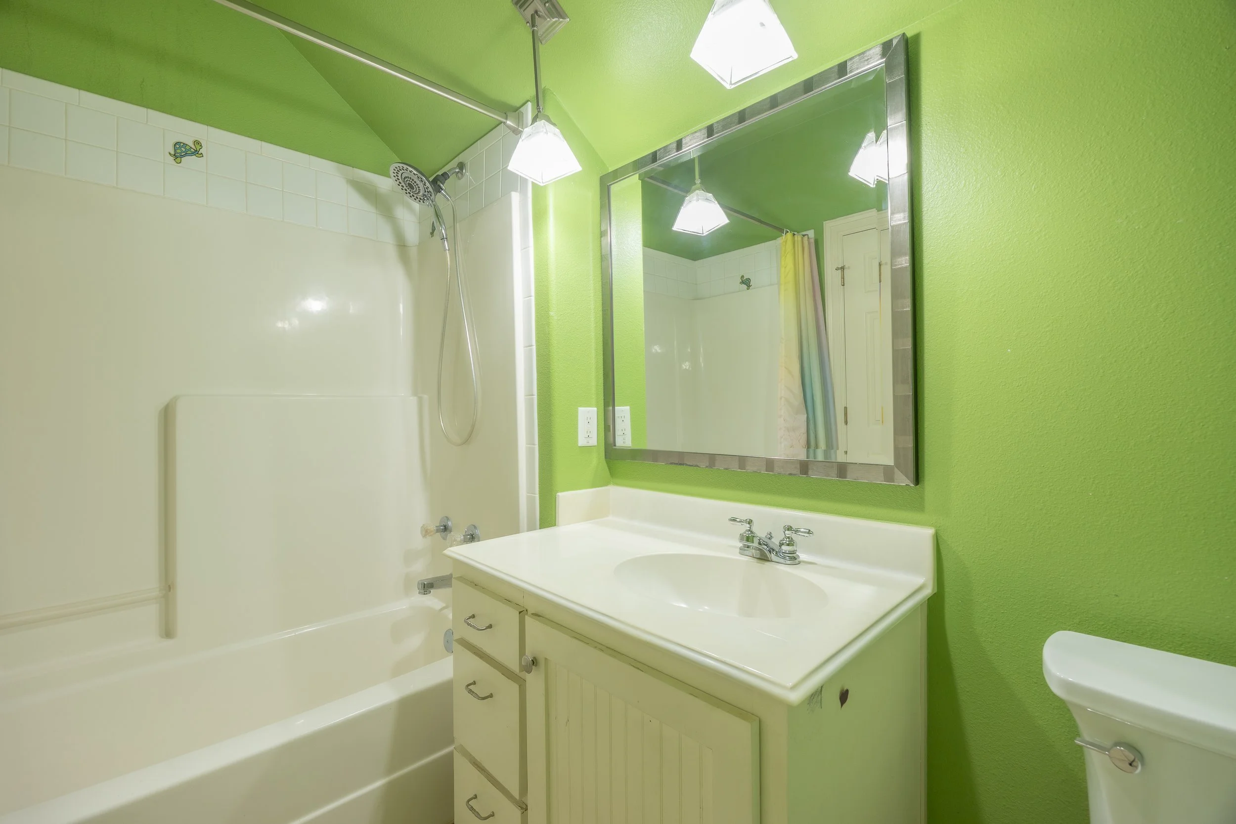 Upstairs, a private sanctuary awaits with an additional bedroom, full bath, and a versatile bonus room.