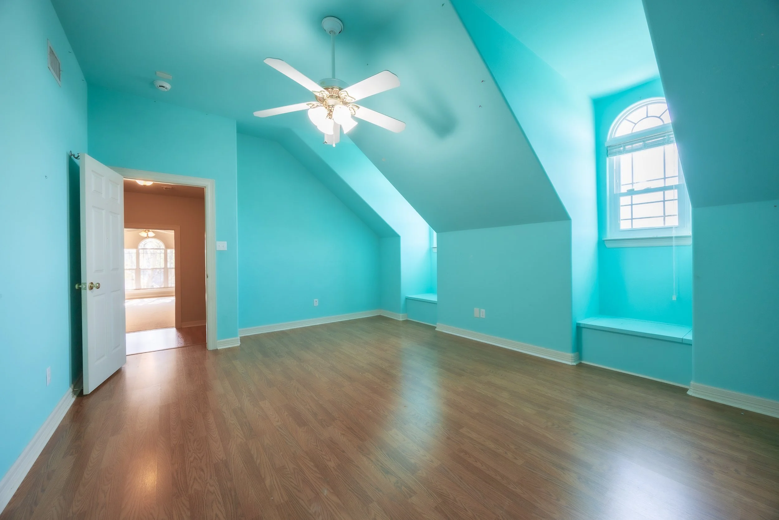 Upstairs, a private sanctuary awaits with an additional bedroom, full bath, and a versatile bonus room.