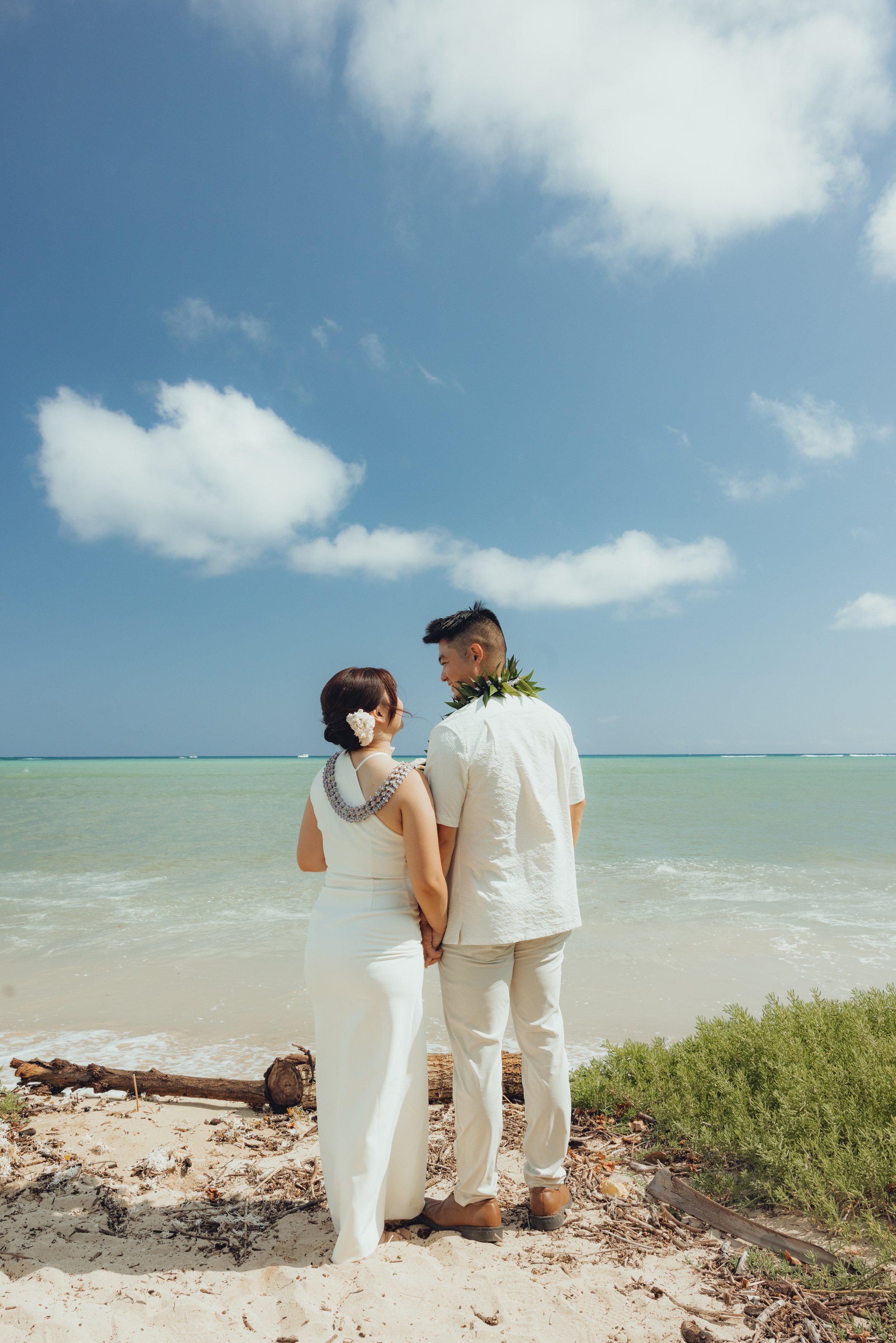Couple standing together by the ocean