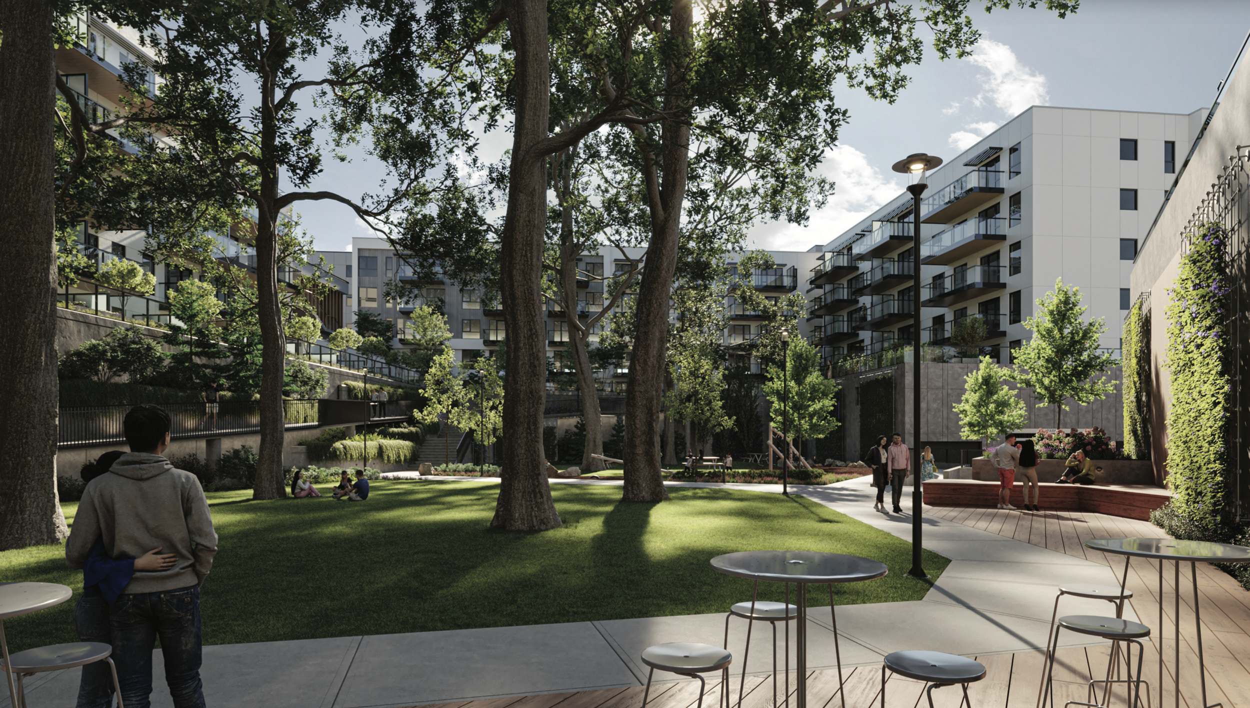 A modern urban courtyard with people sitting and walking, surrounded by trees and tall residential buildings, with outdoor seating and pathway.
