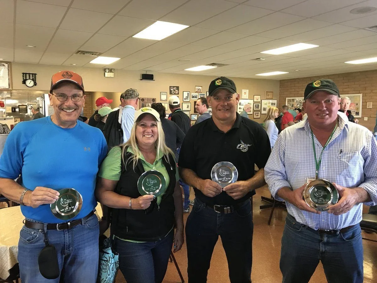 John and Sandy (3 and 4 from left) aiming well at the Turf Producers International Conference in Tucson, Arizona