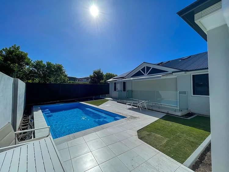 Wintergreen Couch turf being laid at Hope Island Gold Coast.