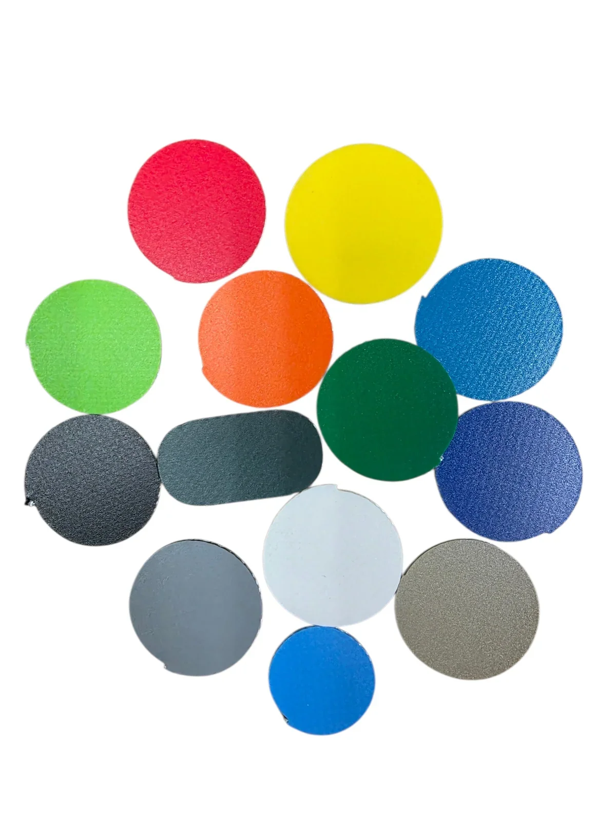 Assorted colorful circular and oval textured swatches arranged on a white background