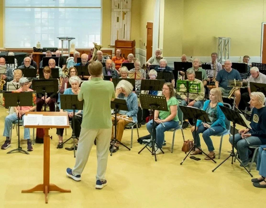 The conductor / director of New Horizons Band Austin leading a rehearsal of the band at Tarrytown United Methodist Church - Fellowship Hall.