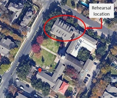 Aerial view of a church complex with a labeled rehearsal location for the New Horizons Band of Austin, Texas and marked boundary circle around a building.