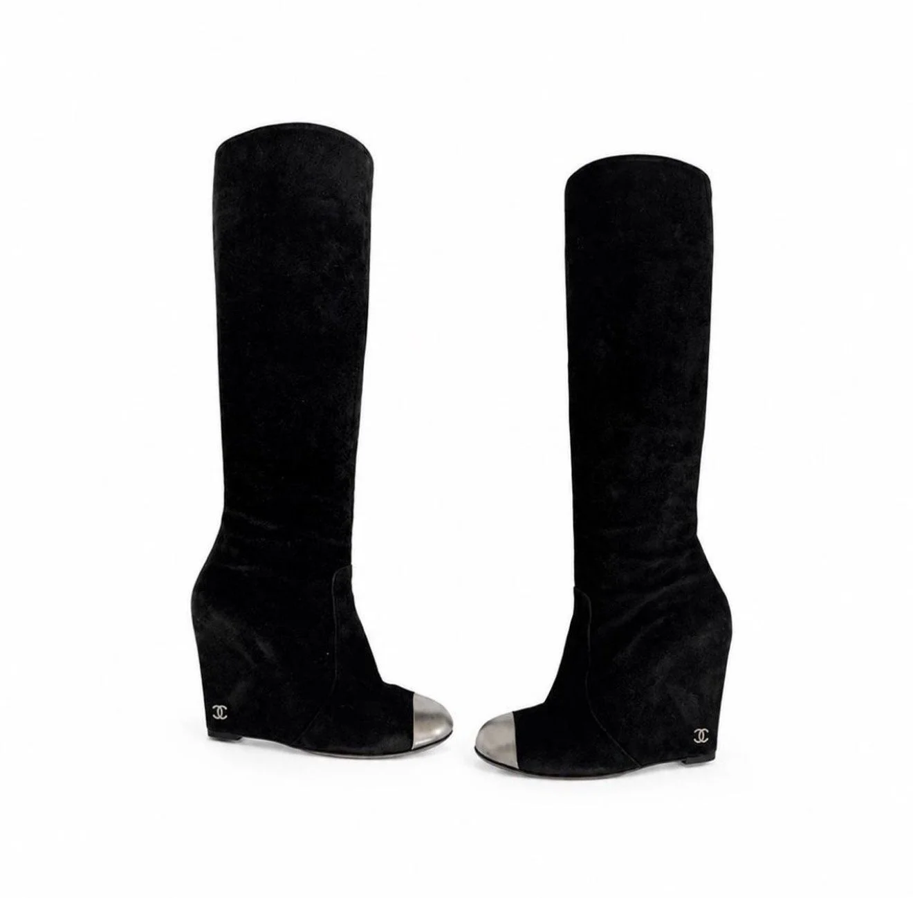 Full view of black Chanel wedge boots