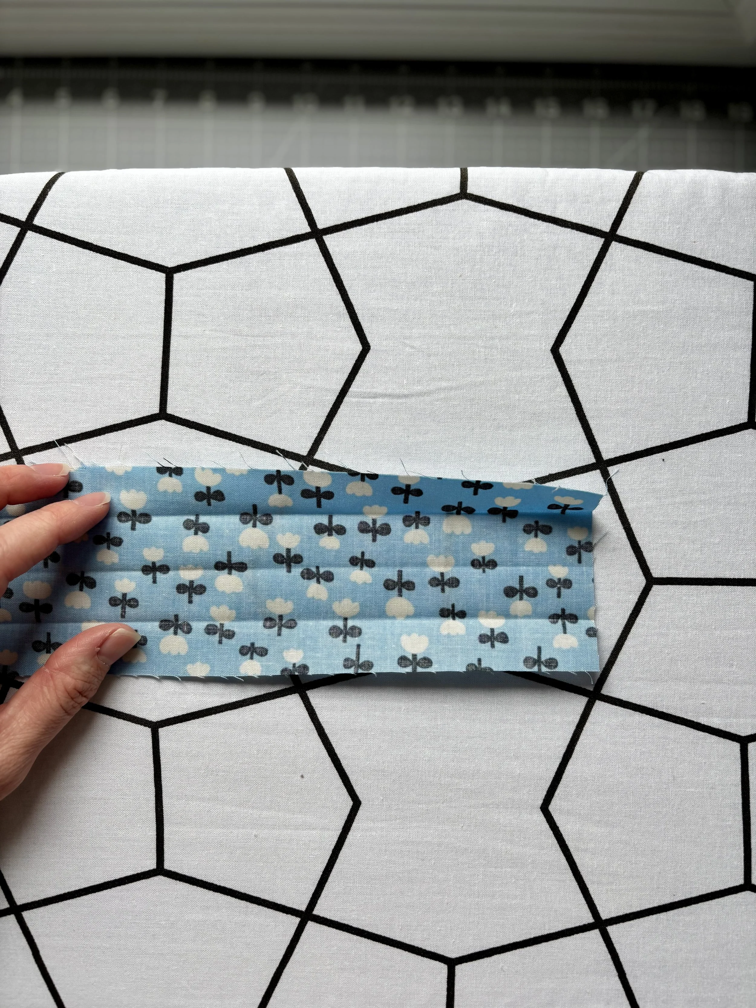 The fabric unfolded completely to demonstrate where the 3 pressed creases should sit