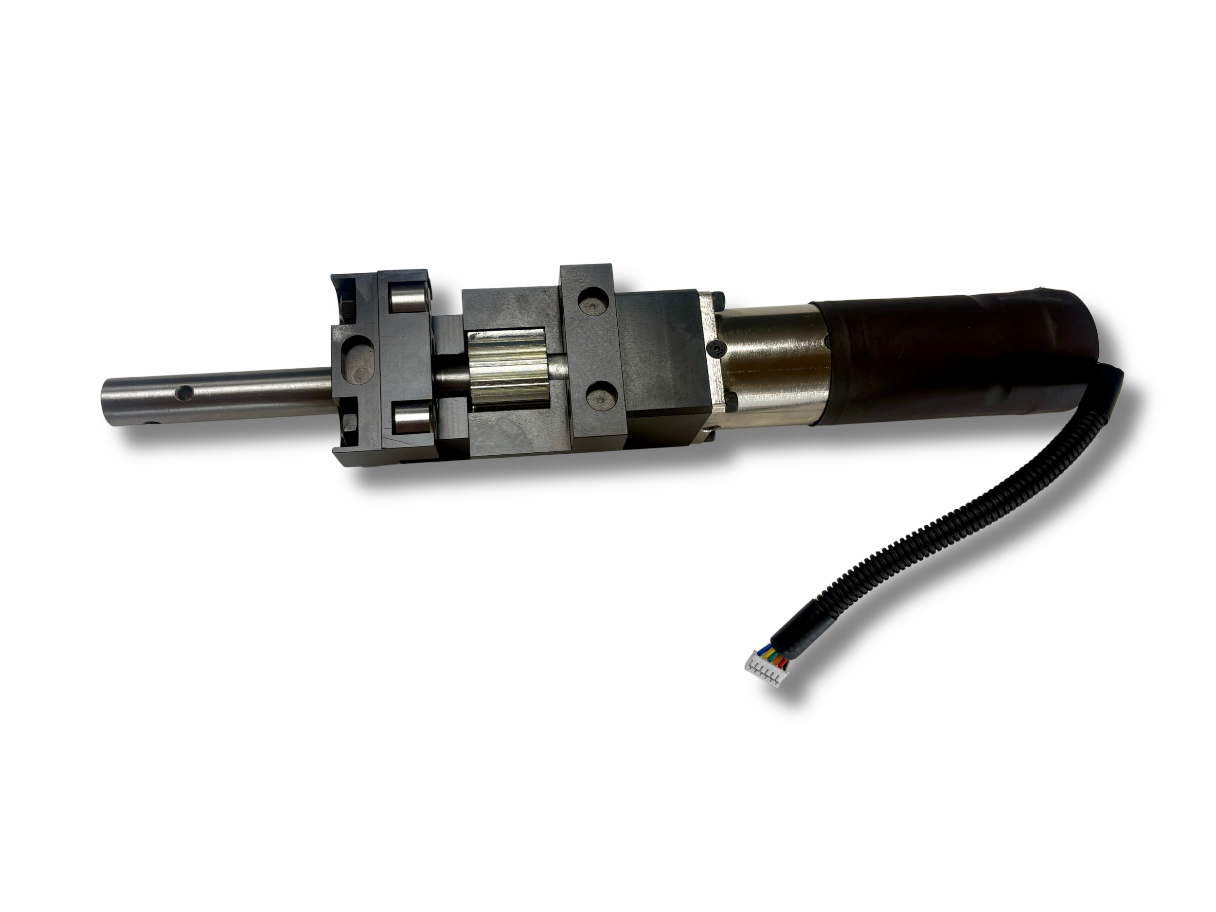 Vroom Slide System mechanical mechanism with metal components and an electrical cable against a clear background.