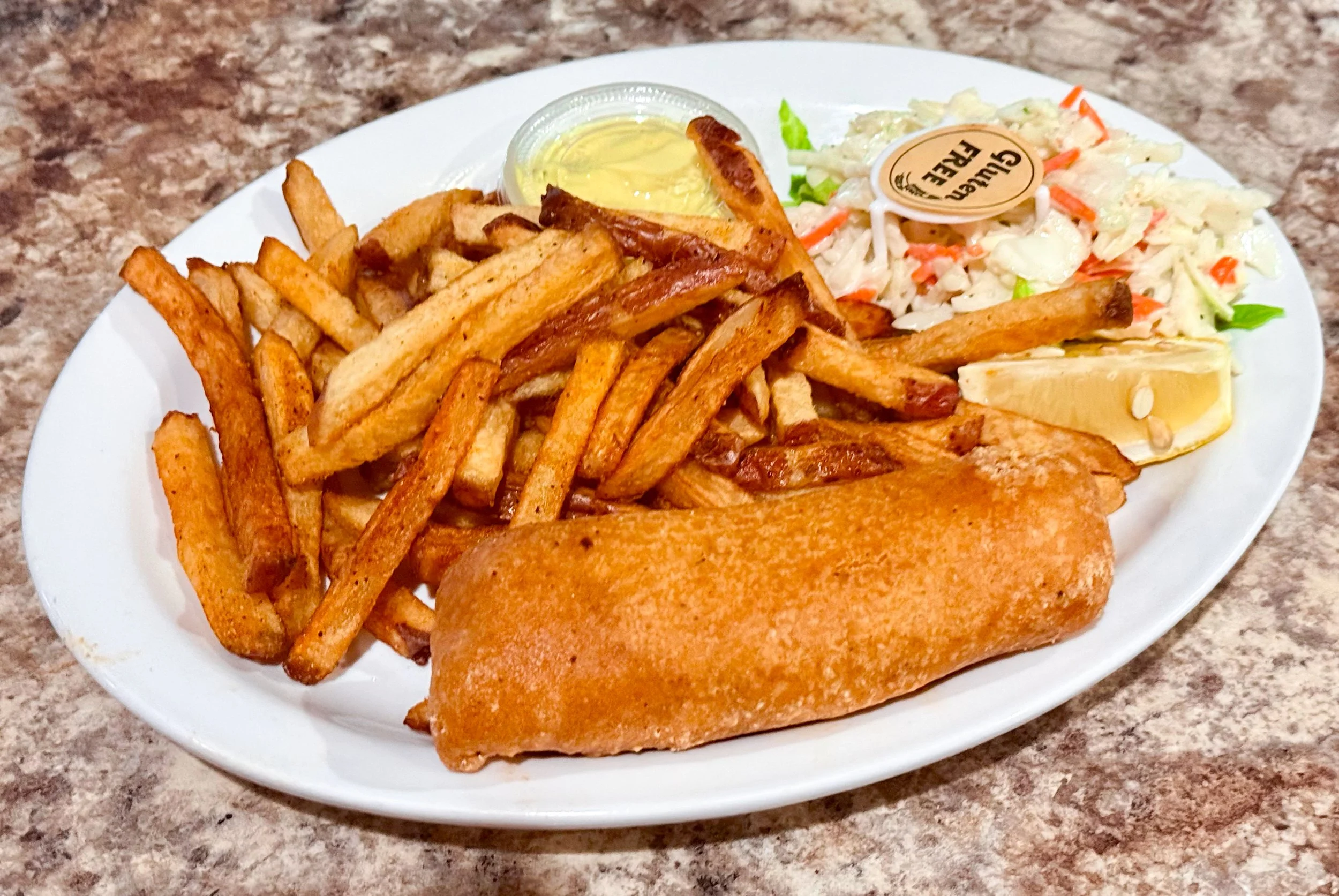 Gluten-free battered cod with homecut fries, coleslaw and lemon at 4Seasons Restaurant in Regina.
