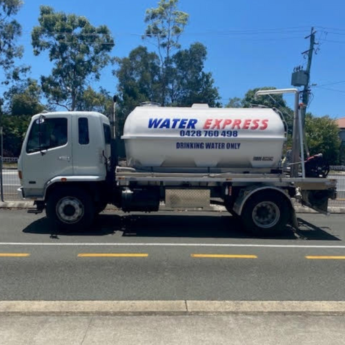 A water delivery truck labeled 'Water Express' parked on the side of the road with trees and power lines in the background.