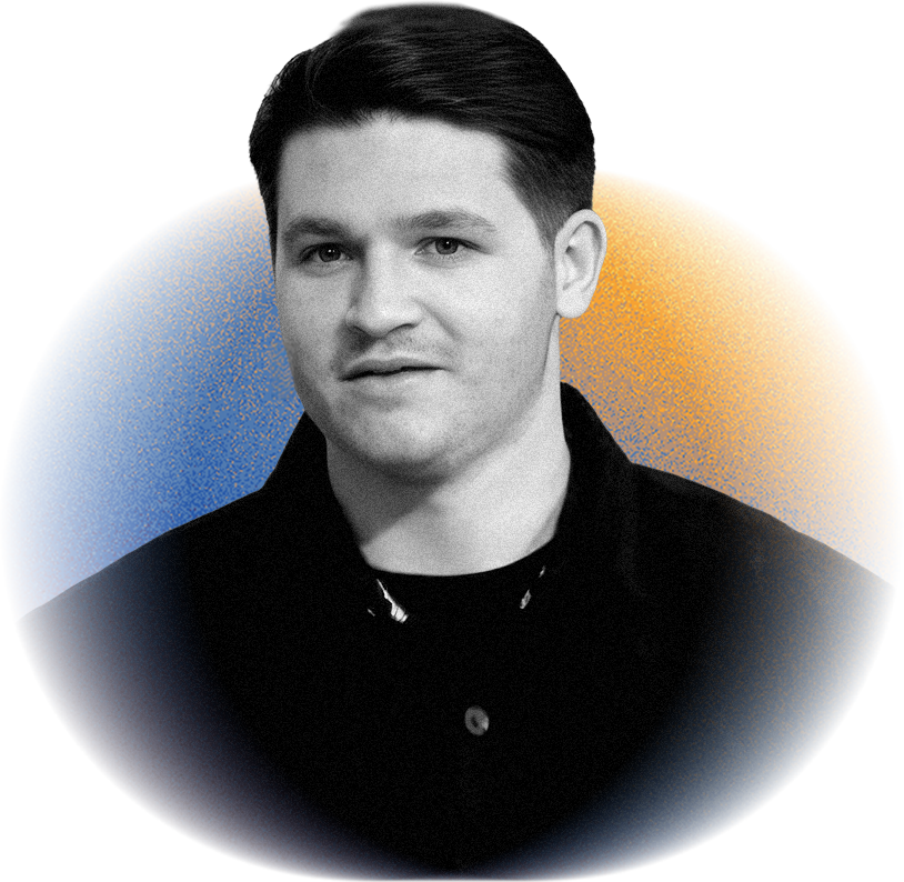 Black-and-white portrait of a young man with dark hair, wearing a dark jacket and shirt, against a colorful abstract background with blue and orange sections.